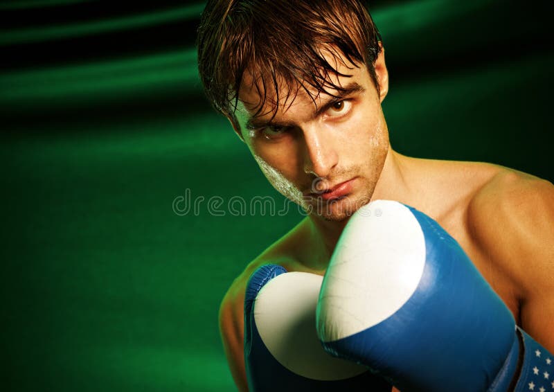 Man sweating all over in boxing gloves