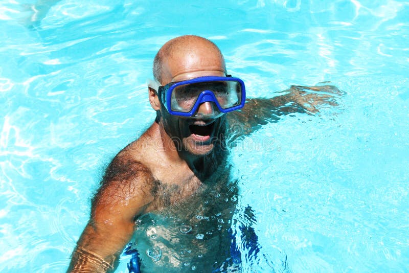 Man having fun in swimming pool. Man having fun in swimming pool.