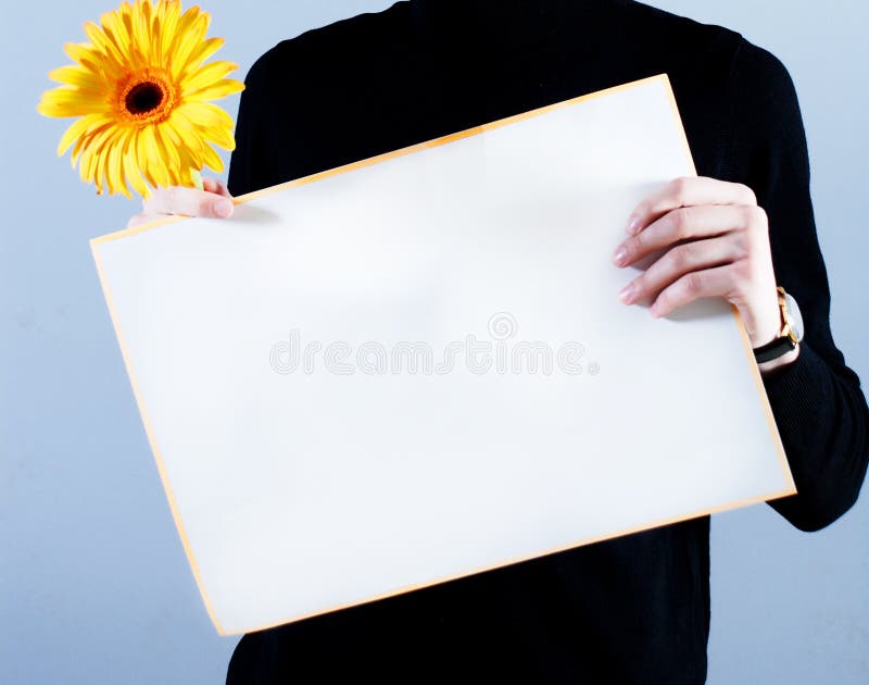 Man takes placard and flower