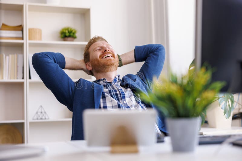 Man Taking a Break and Relaxing while Working in an Office Stock Photo -  Image of confident, people: 254035762