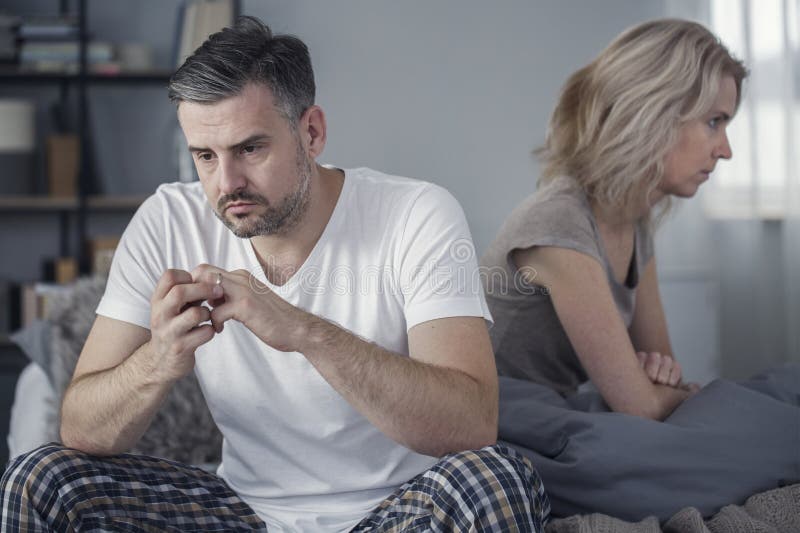 Man taking off his wedding ring after his wife announced that she wanted to get a divorce. Man taking off his wedding ring after his wife announced that she wanted to get a divorce