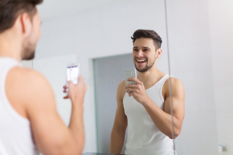 Man Taking Selfie in Bathroom Stock Image Image of morning, mobile