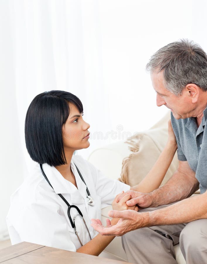 Man talking with his nurse stock photo
