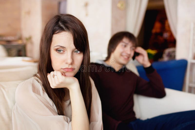 Man talking on the phone and ignores the girl royalty free stock images