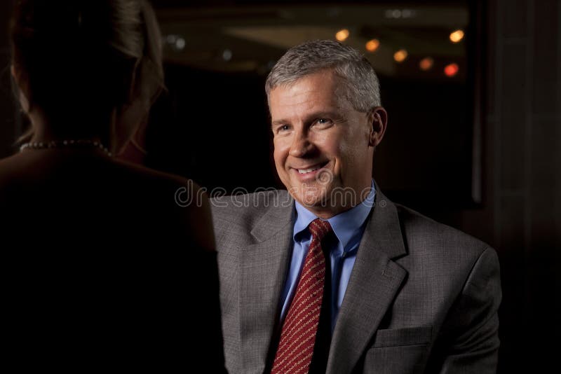 Man Talking with a Woman at a Restaurant/Bar stock photography Man Talking with a Woman at a Restaurant/Bar stock photography