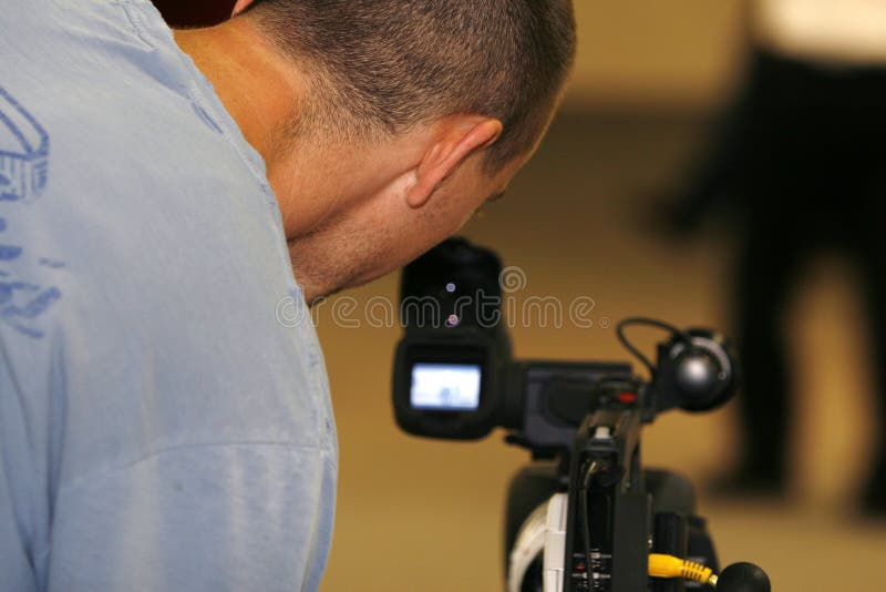 Man Taping with Video Camera Stock Image Image of focus, production