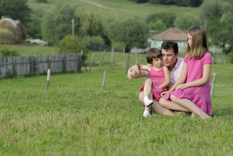 Man teaching kids in nature stock photography