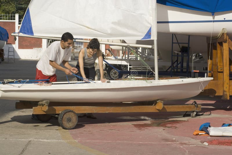 Man Teaching Woman to Sail on Land - Horizontal