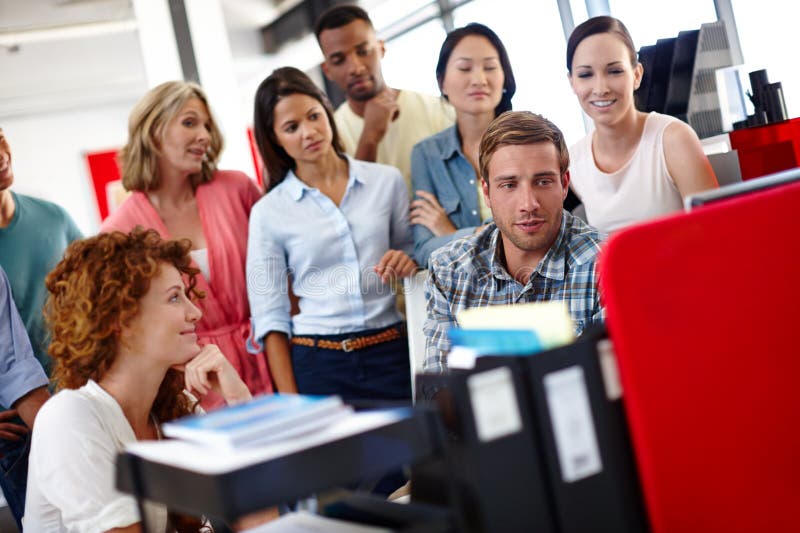 Man, team and huddle by computer in office for meeting, reading and presentation at media company. Person, group and stock images