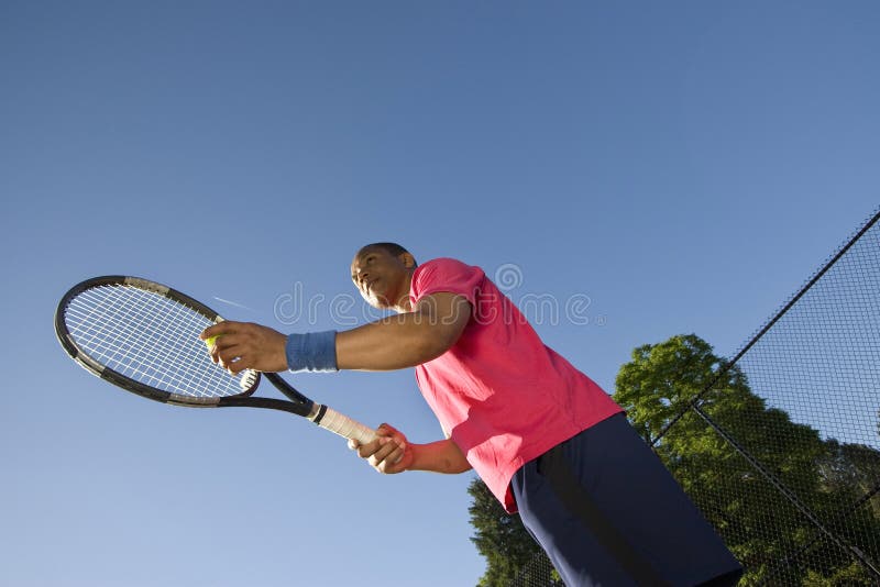 Man on Tennis Court Playing Tennis