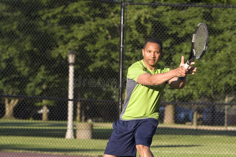 Man on Tennis Court Playing Tennis