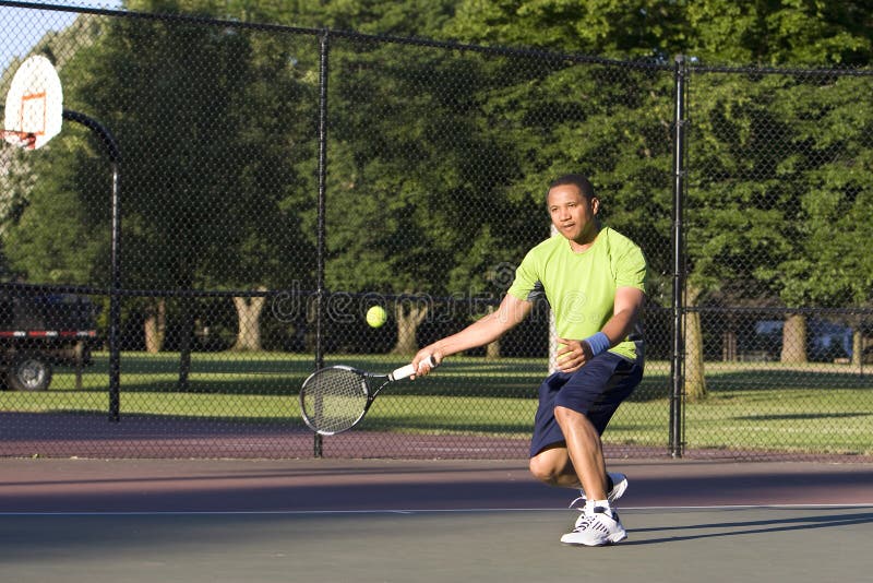 Man on Tennis Court Playing Tennis