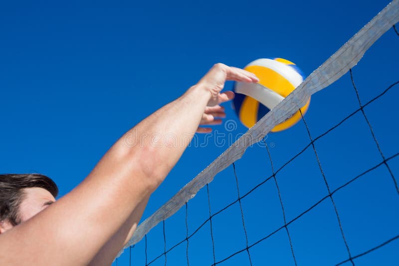 Man Throwing Volleyball Above the Net Stock Photo Image of shore