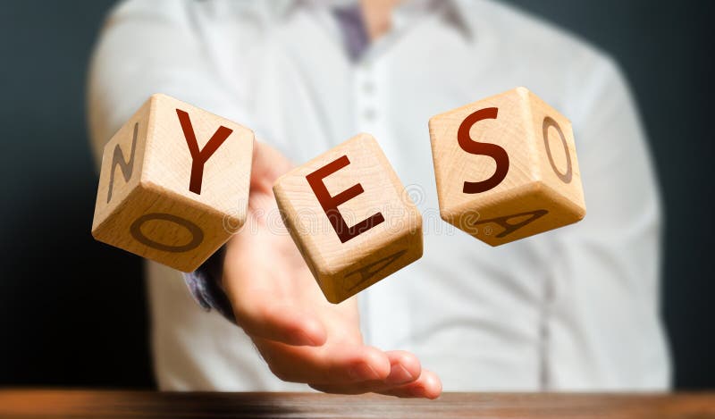 A man throws cubes with letters and makes up the word YES. Agreement and acceptance, answer the question. Courage