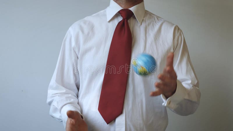 Man in a tie with a red colour, is throwing the globe