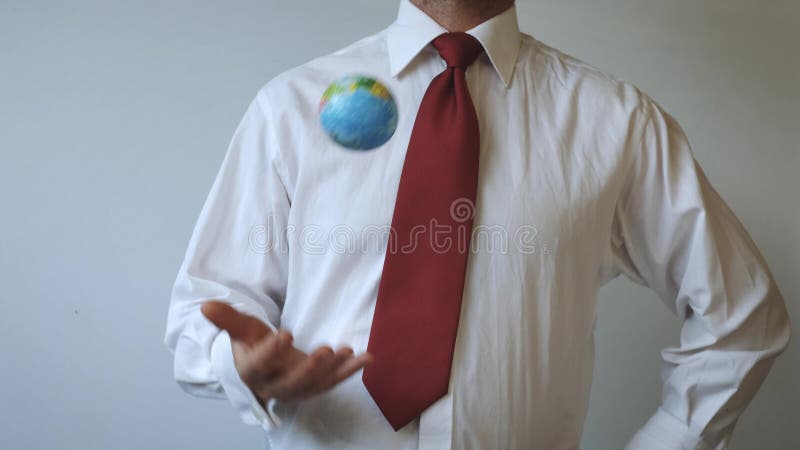 Man in a tie with a red colour, is throwing the globe