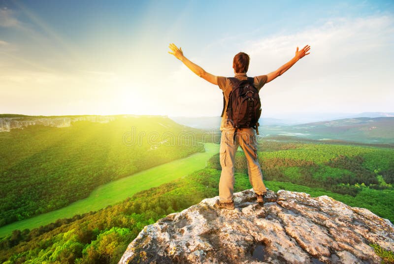 Man on top of mountain