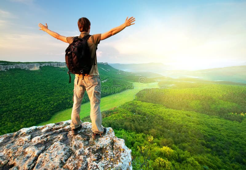 Man on top of mountain