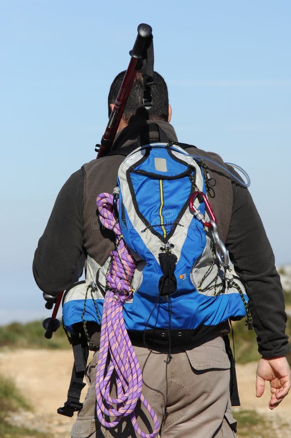 Man in a top of a in mountain hiking