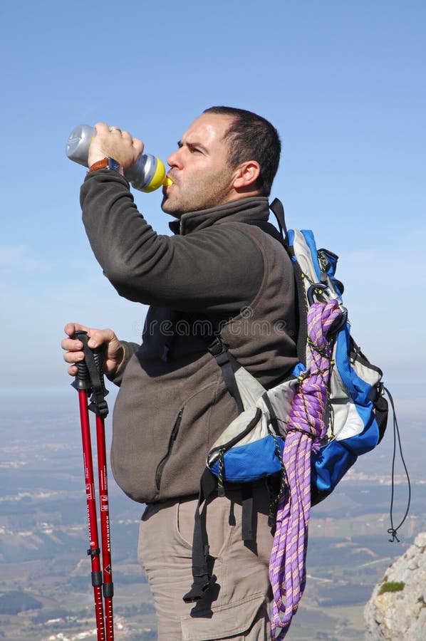 Man in a top of a in mountain hiking