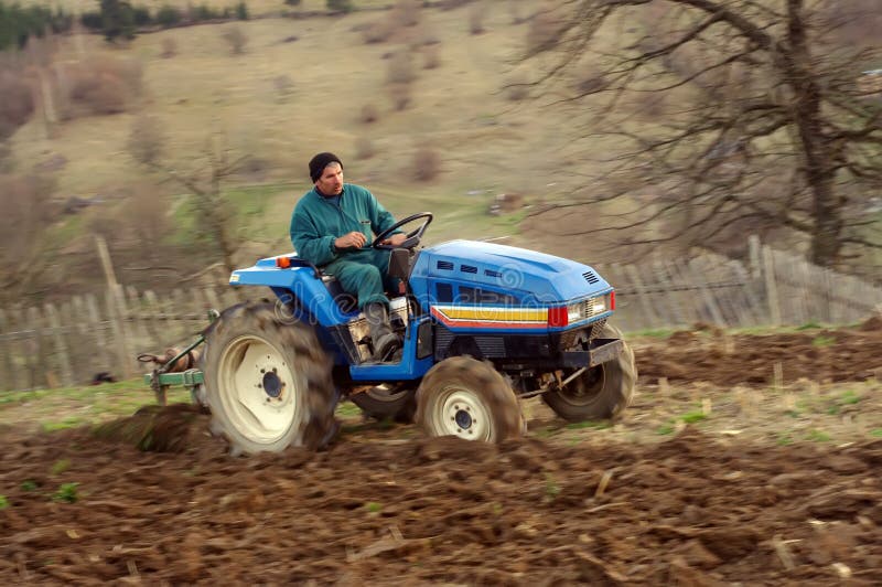 Man on tractor stock photography