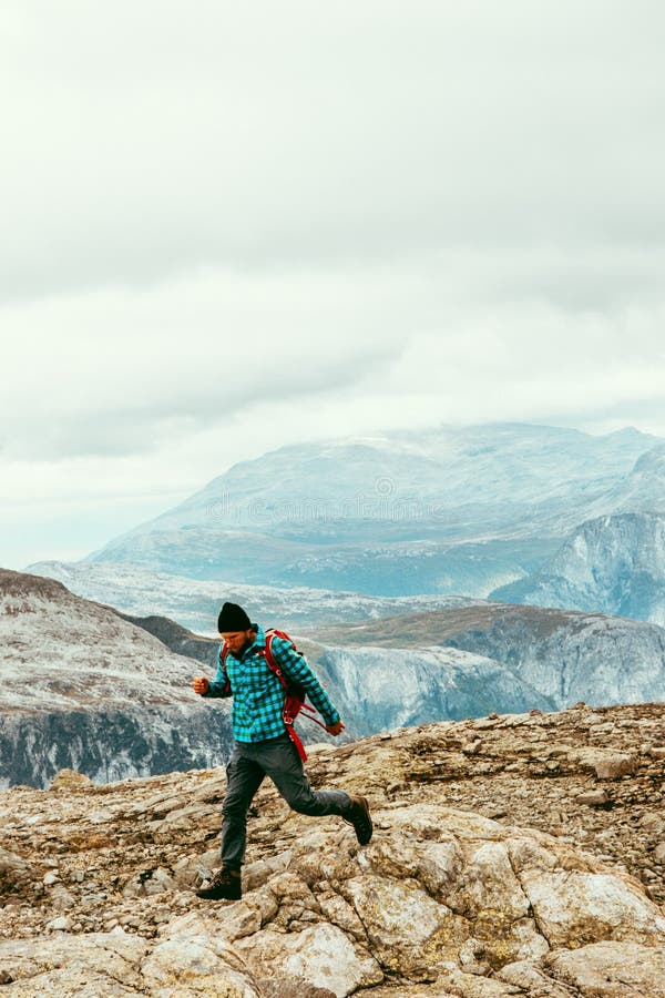 Man trail running in mountains Travel healthy Lifestyle. Sport concept adventure vacations outdoor success and motivation royalty free stock images Man trail running in mountains Travel healthy Lifestyle. Sport concept adventure vacations outdoor success and motivation royalty free stock images