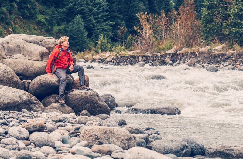 Man Traveler Sits on Mountain River Bank Stock Image Image of range