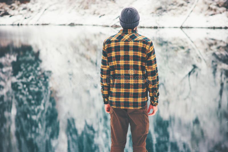 Man Traveling enjoy lake and forest winter. Landscape Travel Lifestyle concept adventure vacations hiking outdoor stock photo Man Traveling enjoy lake and forest winter. Landscape Travel Lifestyle concept adventure vacations hiking outdoor stock photo