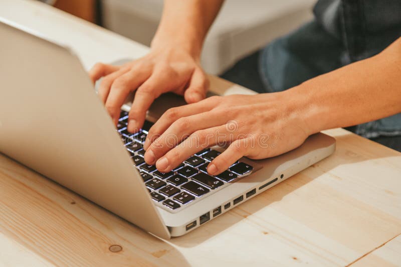 Man Typing on a Modern Laptop royalty free stock images