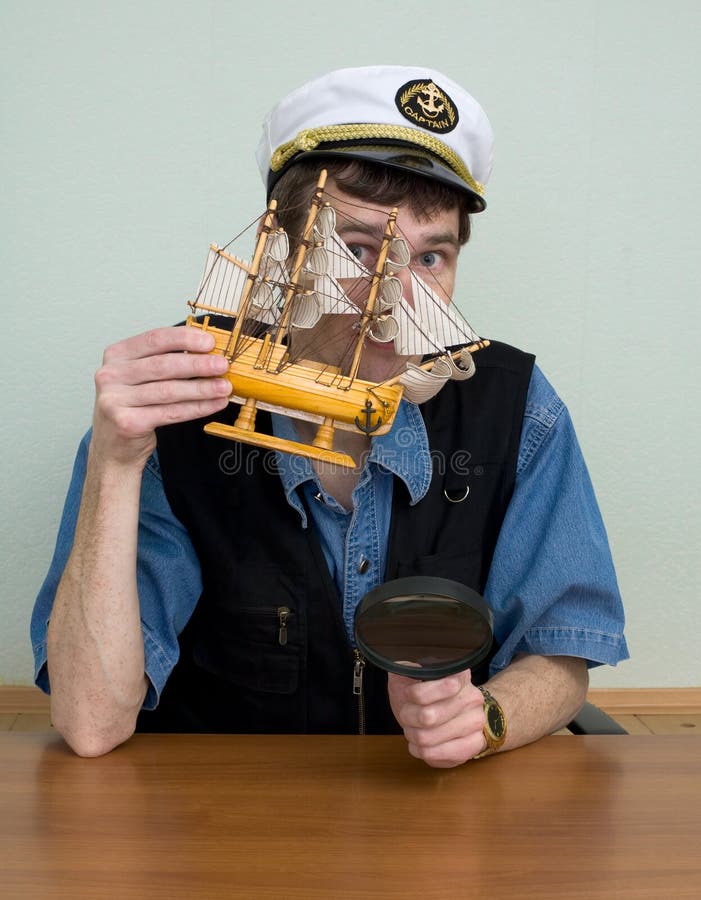 Man in uniform cap with sailer