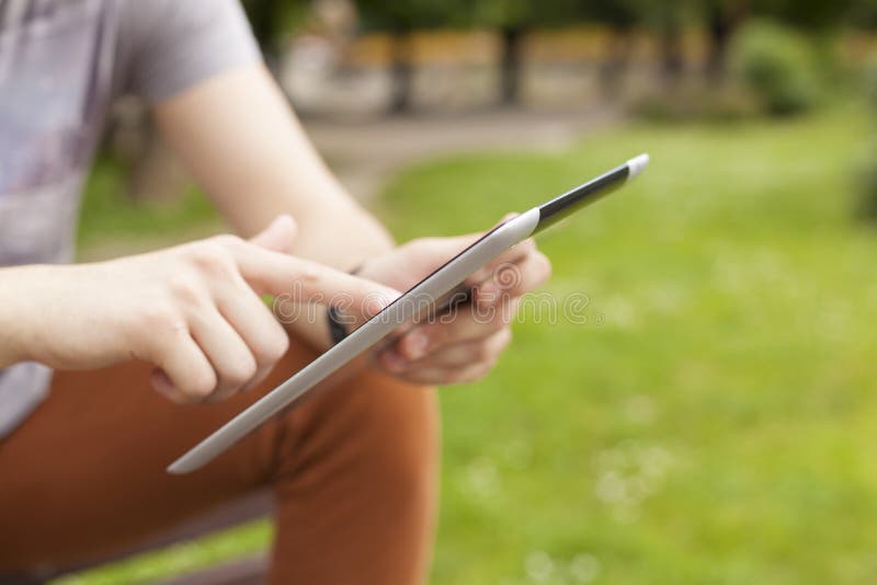 Man use tablet reading news and communicate on social networks