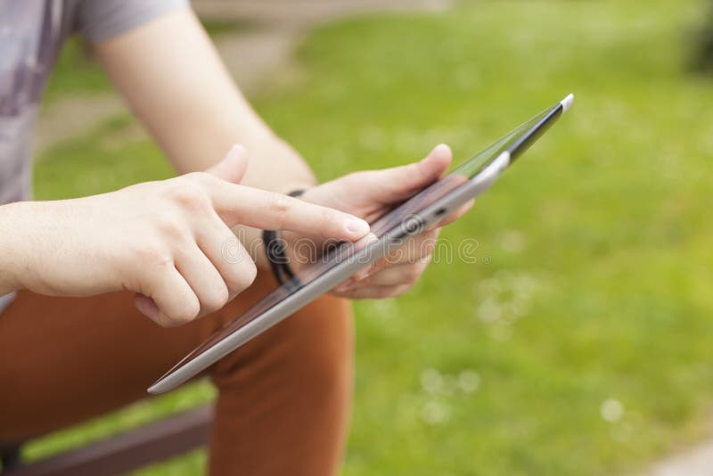 Man use tablet reading news and communicate on social networks