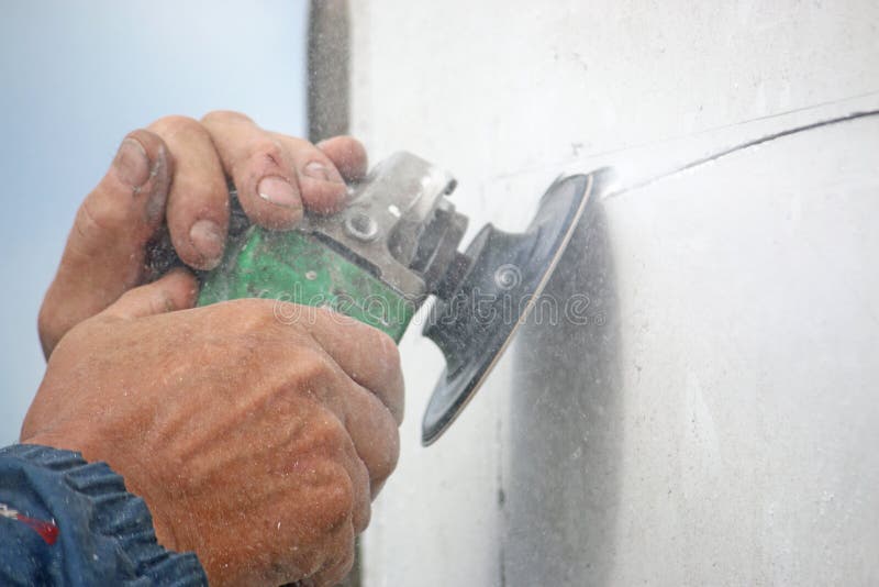 Man using an angle grinder stock photo. Image of fiberglass 238960558