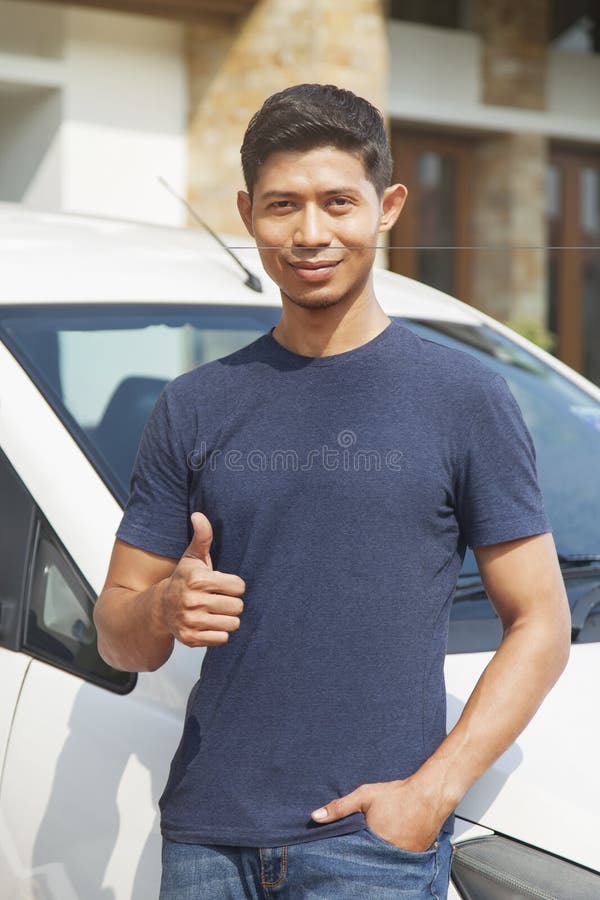 Man Using Battery Jumper Cables on a Dead Battery Stock Photo Image