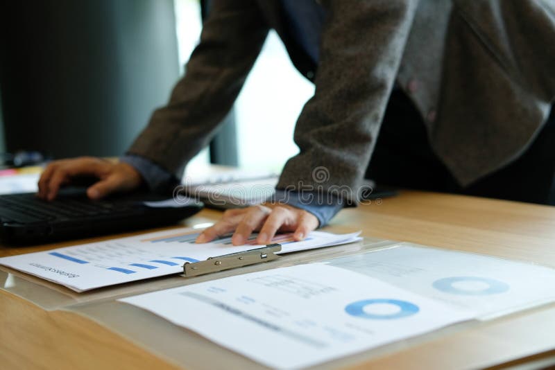 Man using computer. businessman working with financial graph chart