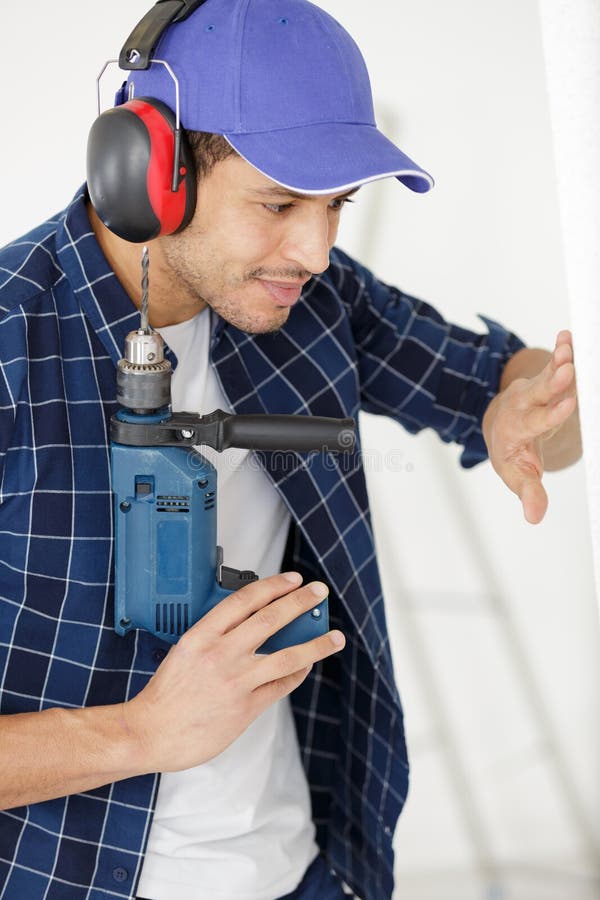 Man using drill stock image. Image of male, construction 210925699