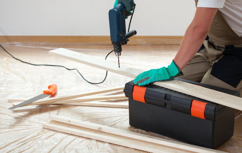 Man using a drill during renovation stock image