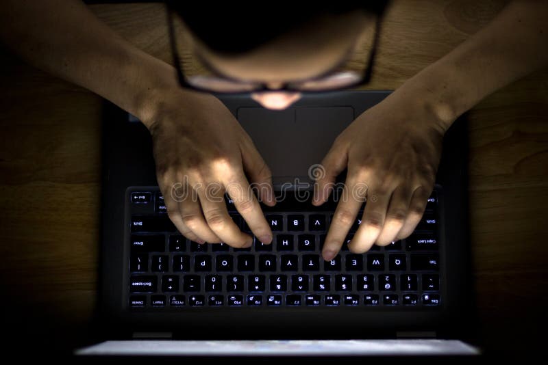 Man Using Laptop in The Dark stock image
