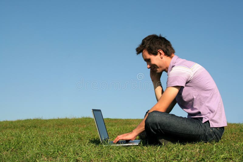 Man using a laptop outdoors royalty free stock photos Man using a laptop outdoors royalty free stock photos