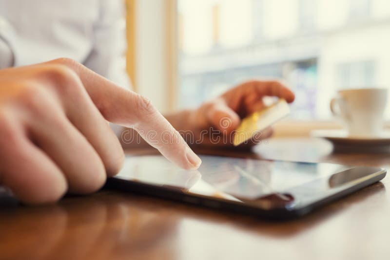 Man using Tablet pc. Credit card, Shopping online. Window