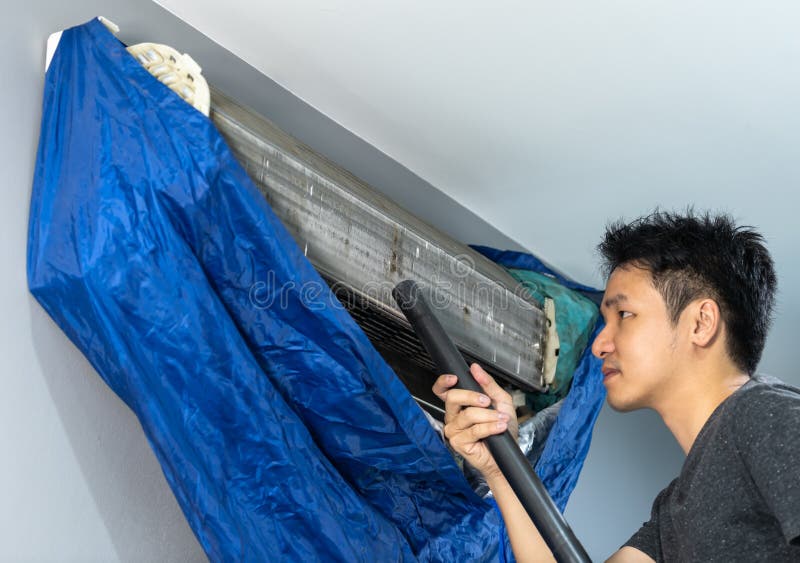 Man Using Vacuum Cleaner To Cleaning Air Conditioner Stock Image Image of asian, filter 158207913