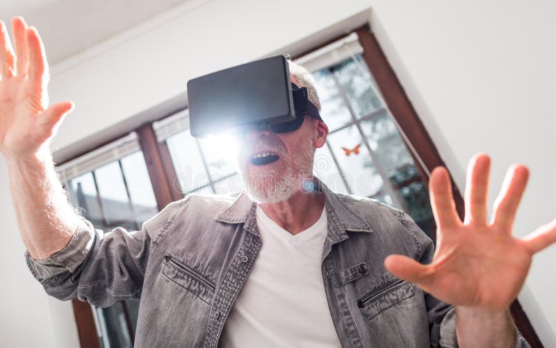 Man Using a Virtual Reality Headset, Hard Light Effect Stock Photo