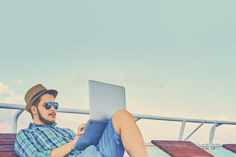 A Man is Working on Vacation. Stock Image Image of successful, screen