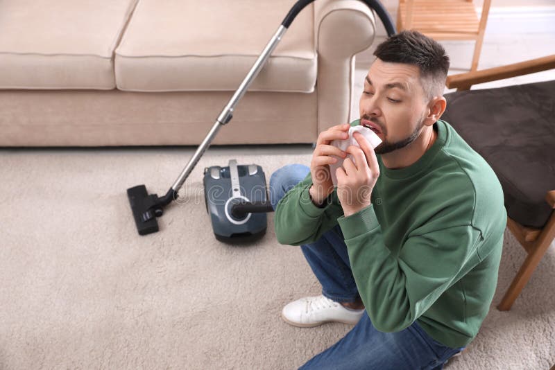 Man with Vacuum Cleaner Suffering from Dust Allergy Stock Image Image