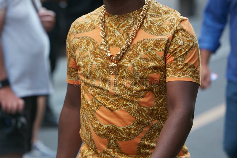 MILAN - JUNE 17: Man with Versace golden necklace and Louis Vuitton phone  cover before Versace fashion show, Milan Fashion Week street style on June  1 Stock Photo - Alamy