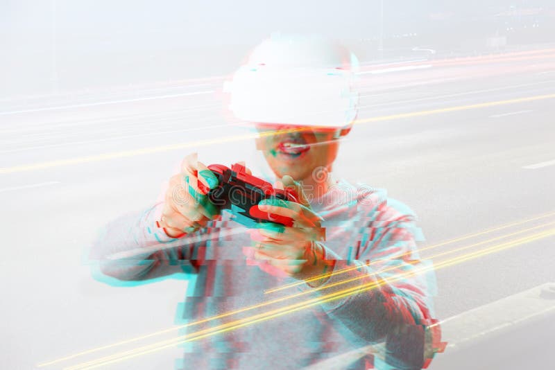 Man with virtual reality headset is playing game. Image with glitch effect. royalty free stock photo