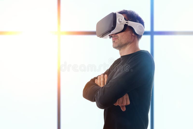 Man with vr glasses and crossed hands and window background royalty free stock images Man with vr glasses and crossed hands and window background royalty free stock images
