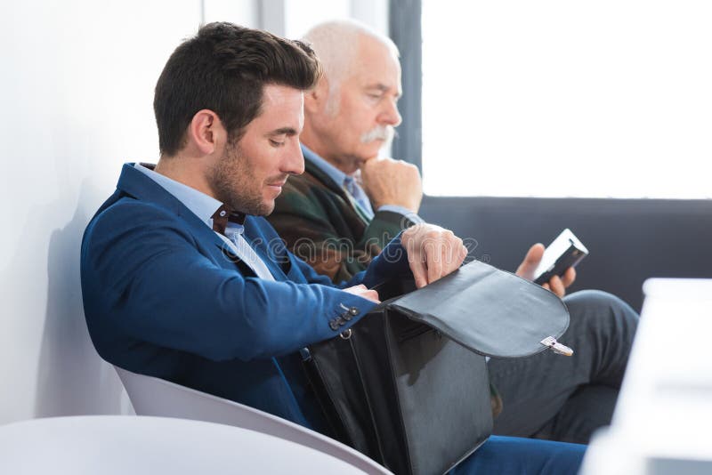 Man waiting for interview indoors royalty free stock photography