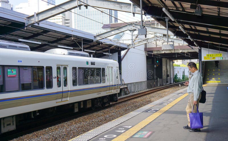 A man waiting for the train at station in Manila Metro, Philippines