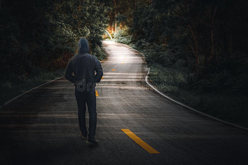 A Man Walking Alone On A Country Road Stock Photo Image Of Light